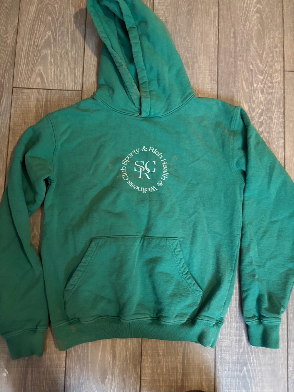 Sporty & Rich teal green hoodie with logo tag